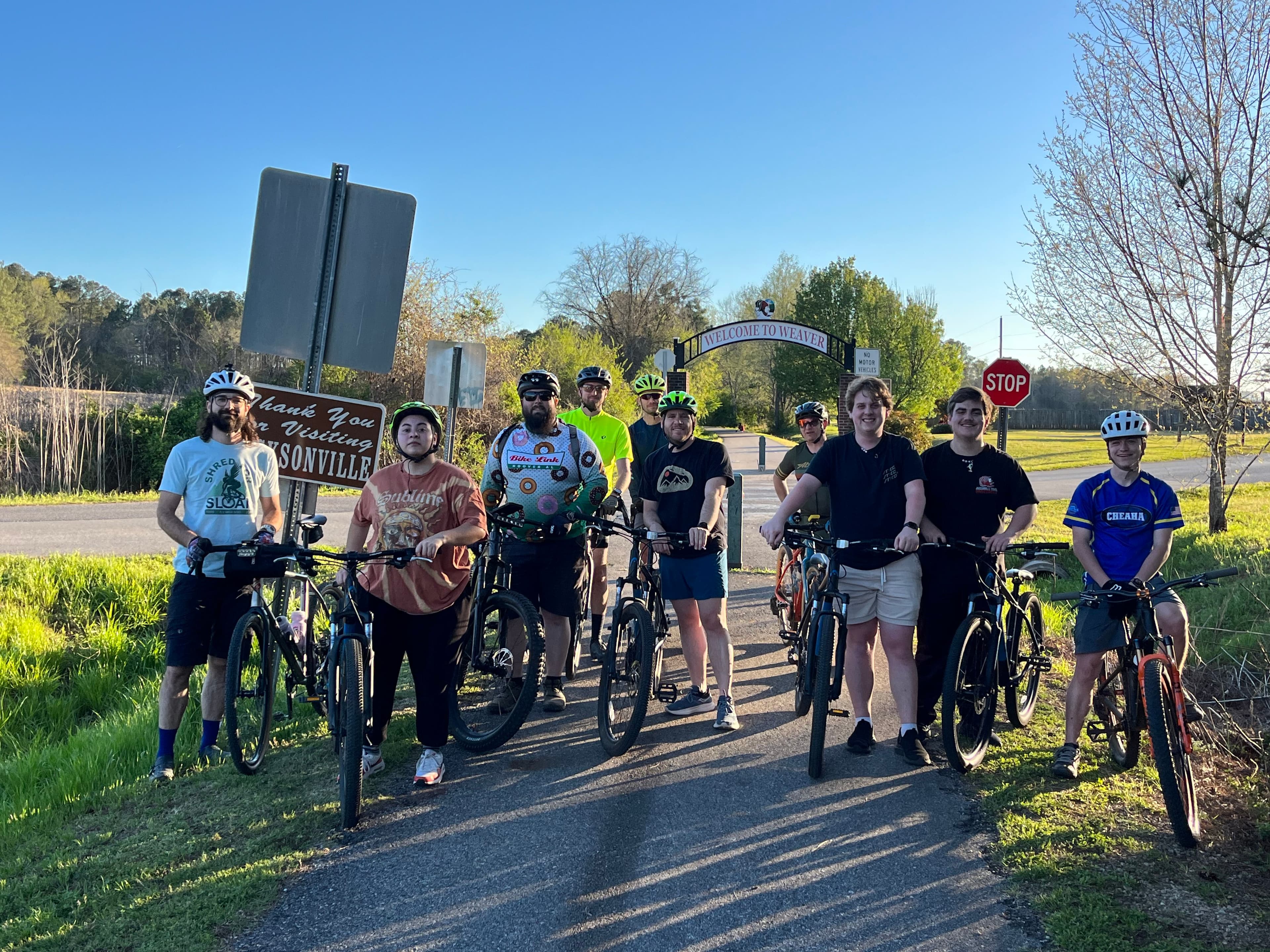 Cycling club members on the Chief Ladiga Trail taking a break at the AJAX Highway intersection.